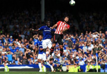Charlie Austin (right) battling for possession in the air