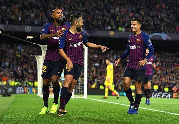 Alba (center) celebrates his finish with Arturo Vidal and Philippe Coutinho as Barcelona seal all three points