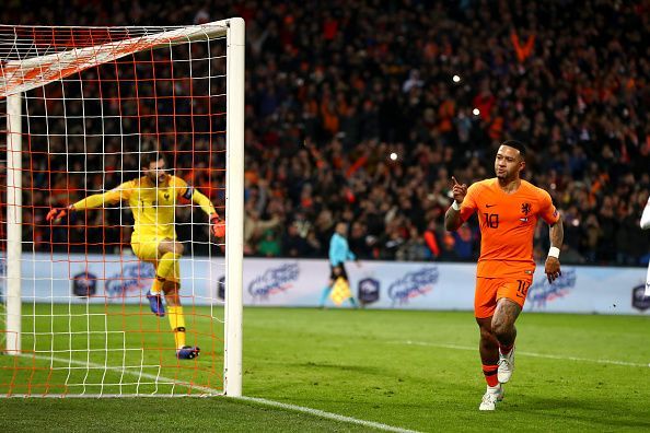 Depay wheels away to celebrate his Panenka penalty in stoppage-time during a memorable win