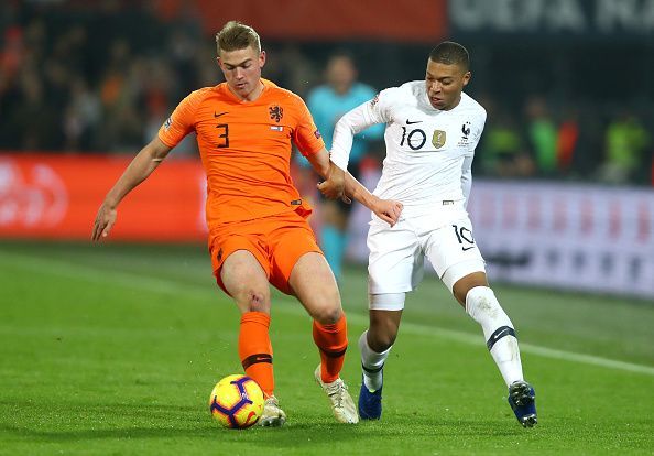 Mbappe trying to battle with Ajax's Matthjis de Ligt for possession during a frustrating evening