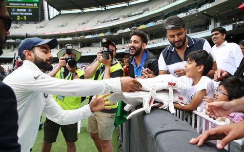 Watch: Virat Kohli brightens up a young fan's day by ...
