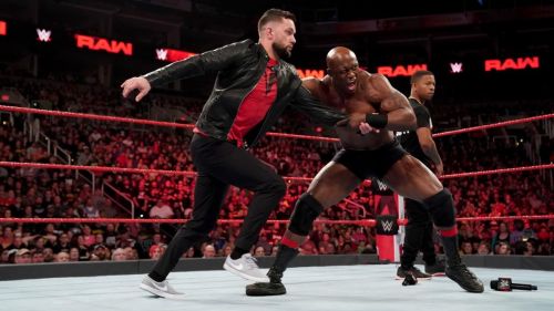 Finn Bálor gets brutalized by Bobby Lashley.