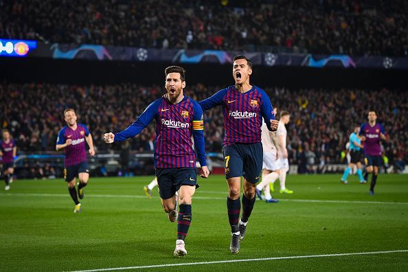 Messi and Coutinho wheel away, celebrating one of the goals during a demolition job vs Manchester United