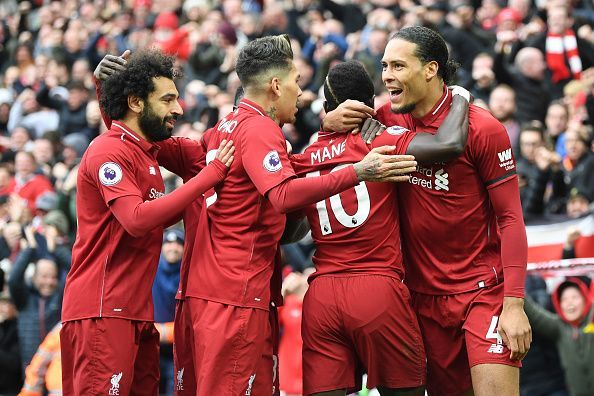 Liverpool players celebrate one of their goals in a must-win game against Chelsea on Sunday afternoon