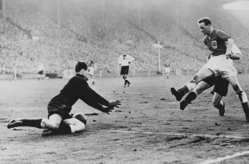 Tom Finney (R) in action for England