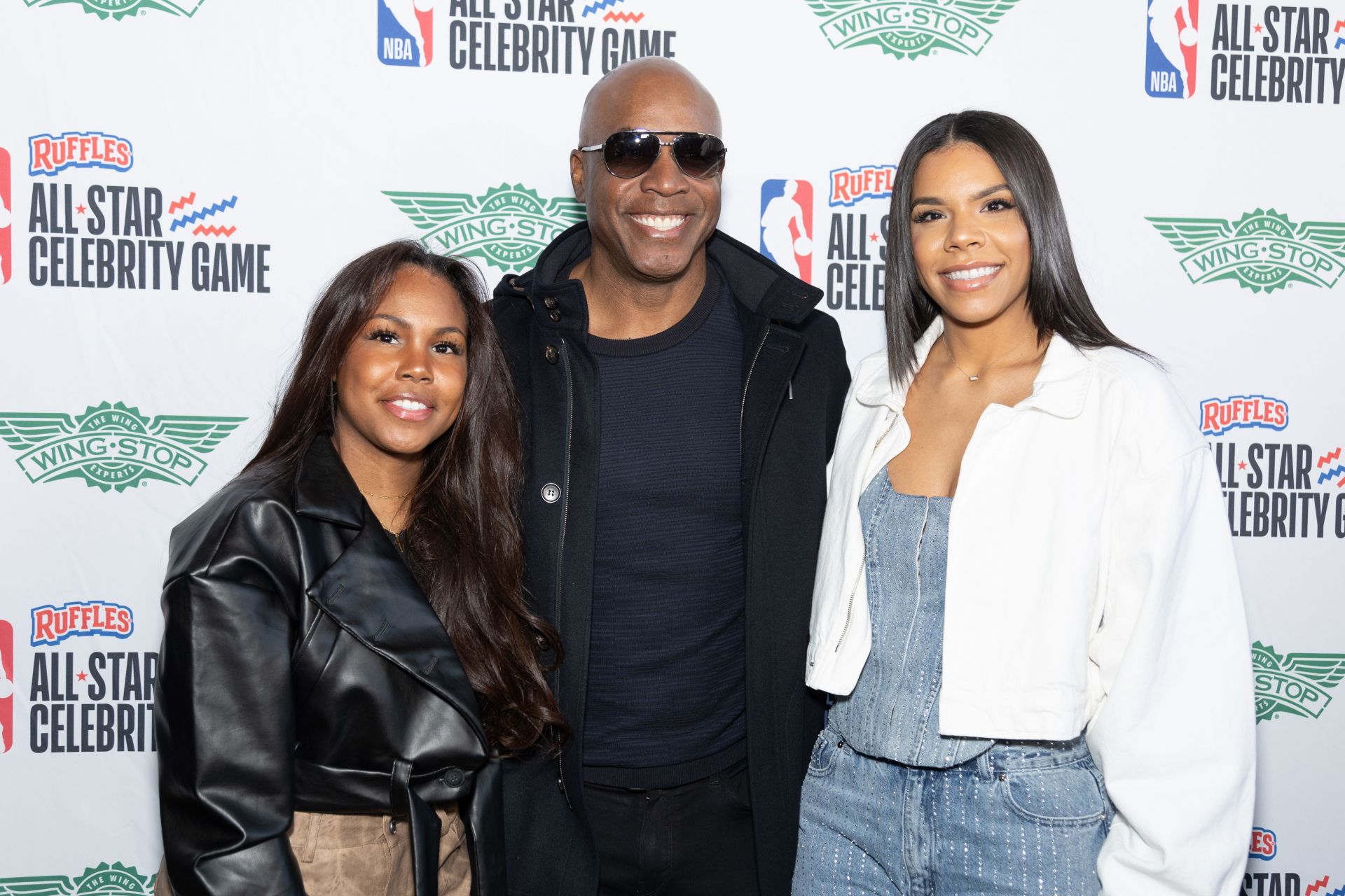 Barry Bonds' daughter Shikari steps out in chic halter-style fashion during her Lake Lanier getaway, pairing the top with wide-leg pinstripe pants