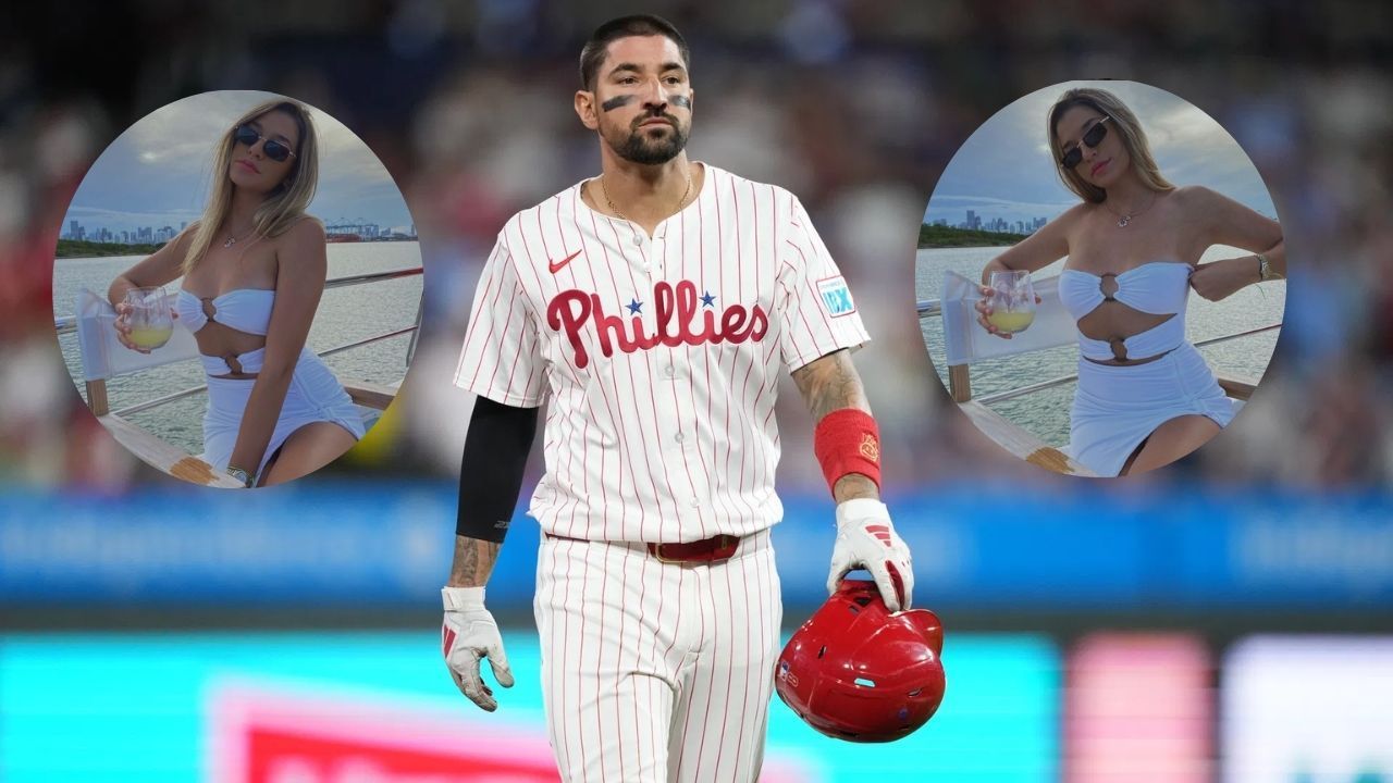 Nick Castellanos' sister Jacqueline rocks a pink bikini top and denim shorts while posing in a mirror selfie with pet Ash