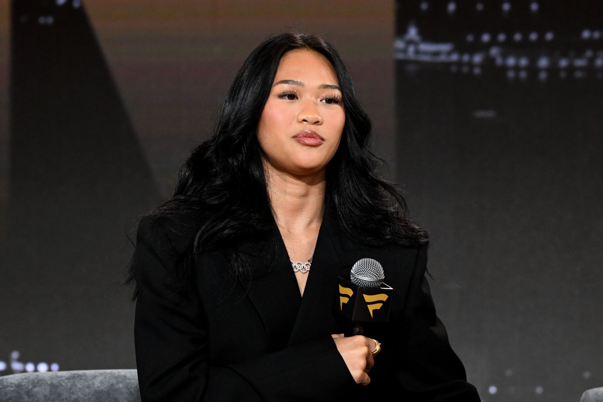 Suni Lee poses in chic striped look at Prada Paradigme launch in New York City