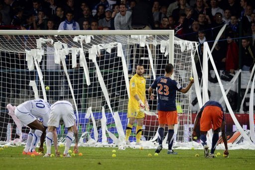 Auxerre's supporters throw tennis balls and toilet paper on the pitch Auxerre's supporters throw tennis balls and toilet paper on the pitch