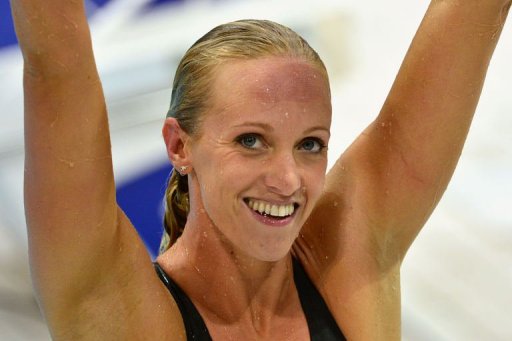 Vollmer wins 100m fly gold in world record