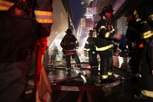 Firefighters work on an early morning storm-related fire in Brooklyn Firefighters work on an early morning storm-related fire in Brooklyn