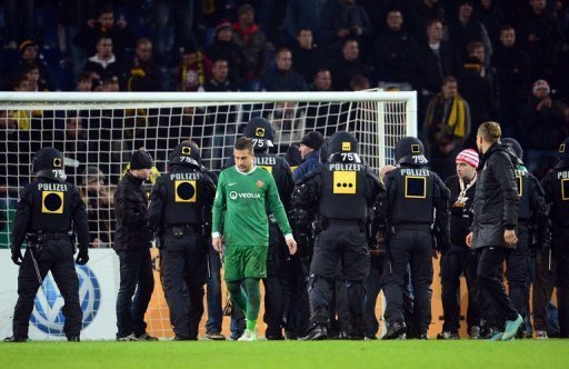 Police secure the inside of stadium in Hanover as fans of Dresden try to storm the pitch on October 31 Police secure the inside of stadium in Hanover as fans of Dresden try to storm the pitch on October 31