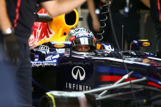 Red Bull Racing's German driver Sebastian Vettel sits in the pits Red Bull Racing's German driver Sebastian Vettel sits in the pits
