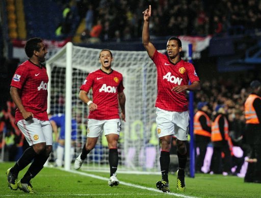 Manchester United's Portuguese midfielder Nani (R) celebrates scoring their third goal against Chelsea Manchester United's Portuguese midfielder Nani (R) celebrates scoring their third goal against Chelsea