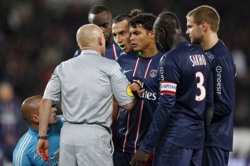 French referee Laurent Duhamel (2ndL) gives a red card to Paris Saint-Germain's forward Zlatan Ibrahimovic (C) French referee Laurent Duhamel (2ndL) gives a red card to Paris Saint-Germain's forward Zlatan Ibrahimovic (C)