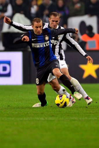 Inter Milan's forward Rodrigo Palacio (L) fights for the ball with Juventus defender Giorgio Chiellini Inter Milan's forward Rodrigo Palacio (L) fights for the ball with Juventus defender Giorgio Chiellini