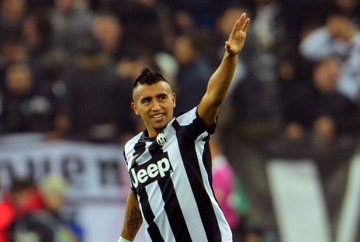 Juventus' midfielder Arturo Vidal celebrates after scoring Juventus' midfielder Arturo Vidal celebrates after scoring