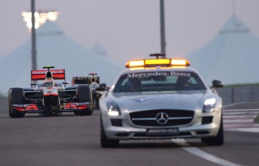 Lewis Hamilton follows the safety car at the Yas Marina circuit Lewis Hamilton follows the safety car at the Yas Marina circuit