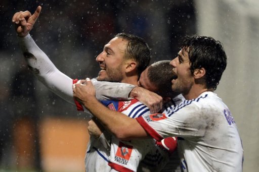 Lyon's Steed Malbranque (L) celebrates with teammates after scoring Lyon's Steed Malbranque (L) celebrates with teammates after scoring