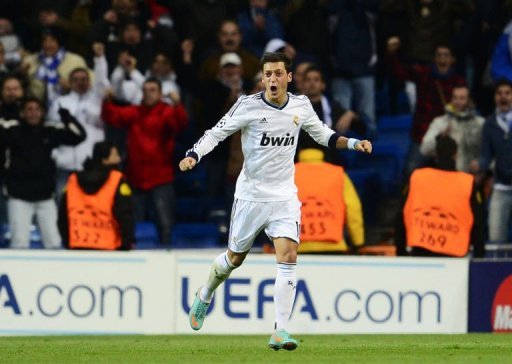 Real Madrid's Mesut Ozil celebrates after scoring Real Madrid's Mesut Ozil celebrates after scoring