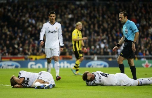 Real Madrid's Pepe (L) and Sergio Ramos lie on the ground after being injured Real Madrid's Pepe (L) and Sergio Ramos lie on the ground after being injured