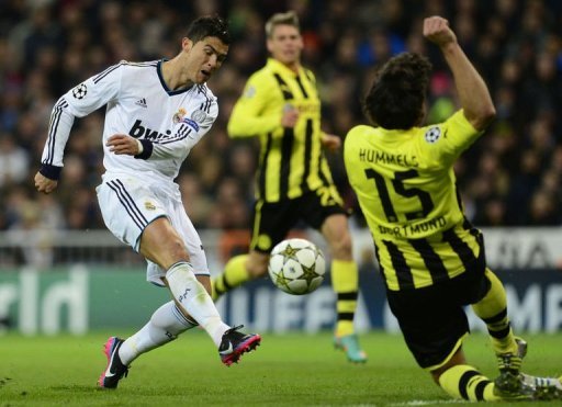 Real Madrid's Cristiano Ronaldo (L) vies with Borussia Dortmund's Mats Hummels Real Madrid's Cristiano Ronaldo (L) vies with Borussia Dortmund's Mats Hummels