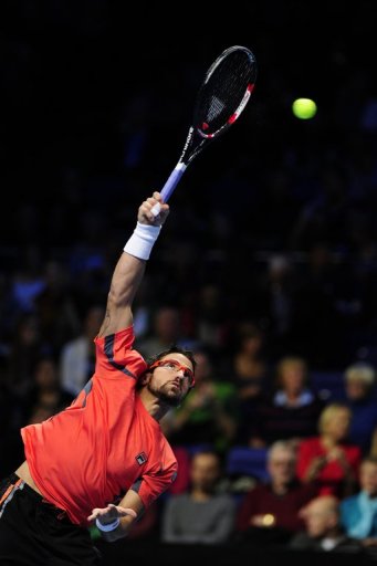 Janko Tipsarevic, pictured, was defeated by Roger Federer in two sets at London's O2 Arena on Tuesday Janko Tipsarevic, pictured, was defeated by Roger Federer in two sets at London's O2 Arena on Tuesday
