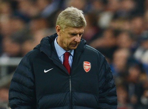 Arsenal's French head coach Arsene Wenger looks dejected during Tuesday's match away to Schalke 04 Arsenal's French head coach Arsene Wenger looks dejected during Tuesday's match away to Schalke 04