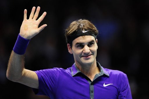 Switzerland's Roger Federer waves as he celebrates beating Spain's David Ferrer in their group B singles match in London Switzerland's Roger Federer waves as he celebrates beating Spain's David Ferrer in their group B singles match in London
