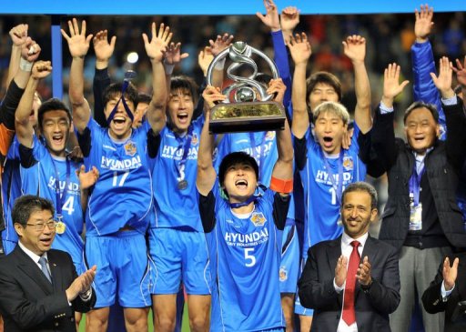 Ulsan midfielder Kwak Tae-Hwi lifts the trophy after his side the AFC Champions League final in Ulsan Ulsan midfielder Kwak Tae-Hwi lifts the trophy after his side the AFC Champions League final in Ulsan