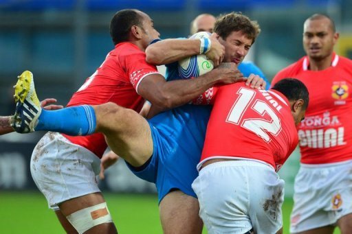 Italy centre Tommaso Benvenuti (C) is tackled by Tonga fullback Lilo Vungakoto (L) and centre Sione Piukala Italy centre Tommaso Benvenuti (C) is tackled by Tonga fullback Lilo Vungakoto (L) and centre Sione Piukala