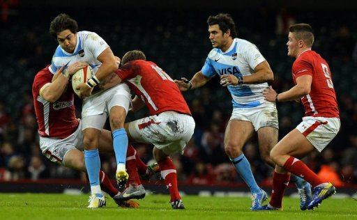 Argentina's Horacia Agulla (2nd L) is tackled by Wales players at the Millennium Stadium Argentina's Horacia Agulla (2nd L) is tackled by Wales players at the Millennium Stadium