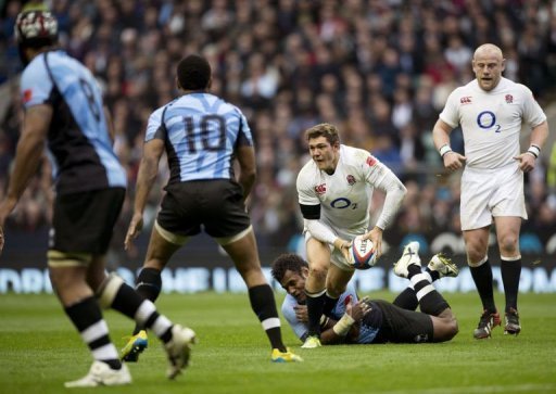 England full-back Alex Goode (C) tries to get a pass away as he gets tackled by Fiji's Sireli Naqelevuki England full-back Alex Goode (C) tries to get a pass away as he gets tackled by Fiji's Sireli Naqelevuki