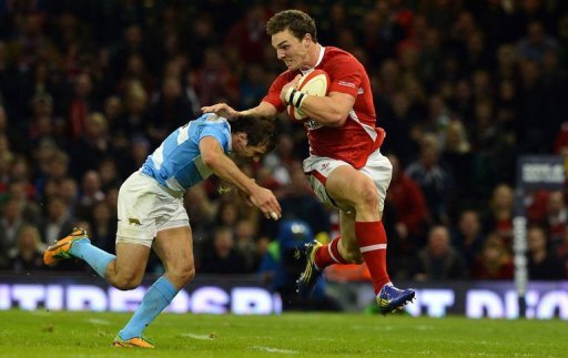 Wales' wing George North (R) hands off Argentina's wing Gonzalo Camacho Wales' wing George North (R) hands off Argentina's wing Gonzalo Camacho