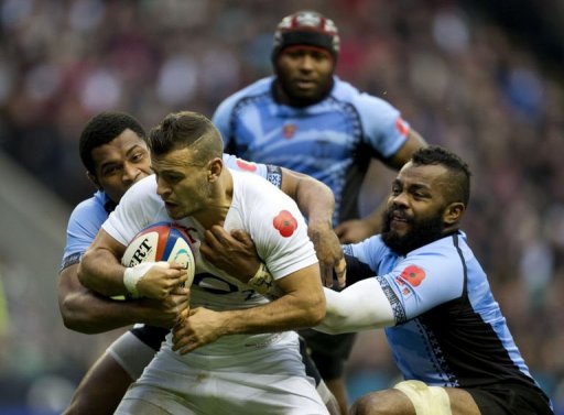 England's scrum half Danny Care (2nd L) gets tackled by Fiji's Nikola Matawalu (L) and Metuisela Talebula England's scrum half Danny Care (2nd L) gets tackled by Fiji's Nikola Matawalu (L) and Metuisela Talebula