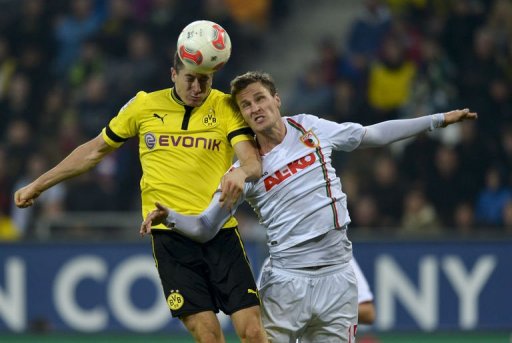 FC Augsburg's defender Sebastian Langkamp (R) and Dortmund's striker Robert Lewandowski jump for the ball FC Augsburg's defender Sebastian Langkamp (R) and Dortmund's striker Robert Lewandowski jump for the ball