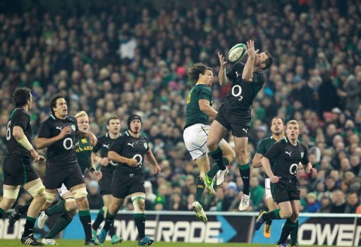 Ireland's wing Tommy Bowe (R) jumps for the ball with South Africa's full back Zane Kirchner Ireland's wing Tommy Bowe (R) jumps for the ball with South Africa's full back Zane Kirchner