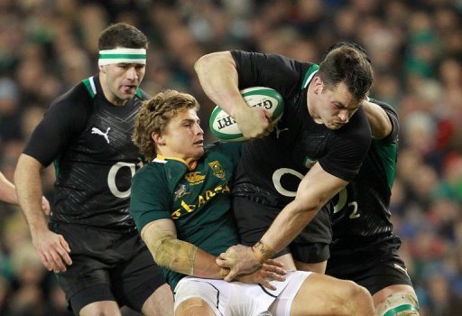 Ireland's prop Cian Healy (R) is tackled by South Africa's fly half Pat Lambie (2nd L) Ireland's prop Cian Healy (R) is tackled by South Africa's fly half Pat Lambie (2nd L)