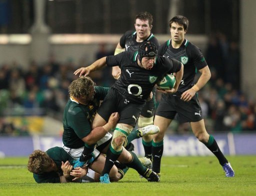 Ireland's hooker Richardt Strauss (2nd R) evades a tackle from South Africa's prop Jannie du Plessis (2nd L) Ireland's hooker Richardt Strauss (2nd R) evades a tackle from South Africa's prop Jannie du Plessis (2nd L)
