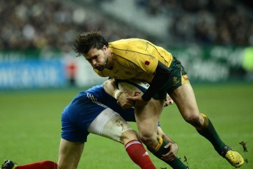 Australia's wing Adam Ashley-Cooper (R) is tackled by France scrum half Morgan Parra Australia's wing Adam Ashley-Cooper (R) is tackled by France scrum half Morgan Parra