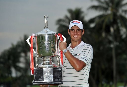 Matteo Manassero poses with the winner's trophy on day four of the Singapore Open Matteo Manassero poses with the winner's trophy on day four of the Singapore Open
