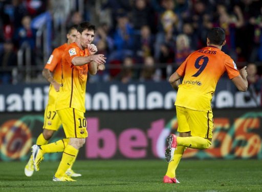Barcelona's Lionel Messi (L) celebrates after scoring Barcelona's Lionel Messi (L) celebrates after scoring