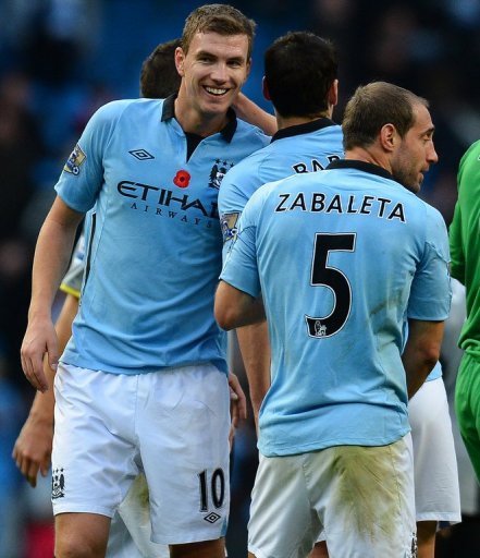 Roberto Mancini admits that Edin Dzeko (L) is not satisfied with his role as Manchester City's 'super sub' Roberto Mancini admits that Edin Dzeko (L) is not satisfied with his role as Manchester City's 'super sub'