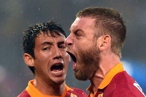 AS Roma's defender Ivan Rodrigo Piris (L) and midfielder Daniele De Rossi react during the derby AS Roma's defender Ivan Rodrigo Piris (L) and midfielder Daniele De Rossi react during the derby