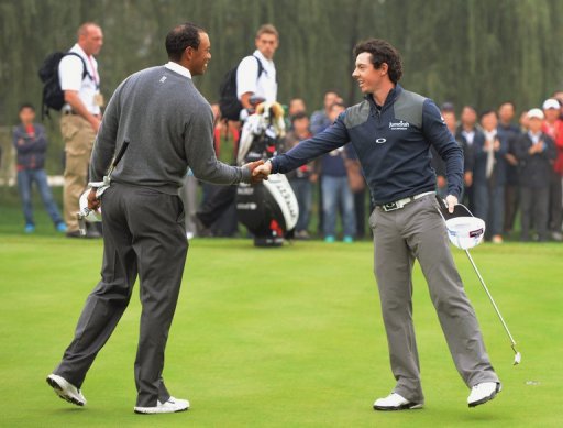 Tiger Woods of the US (L) shakes hands with Rory McIlroy of Northern Ireland in October Tiger Woods of the US (L) shakes hands with Rory McIlroy of Northern Ireland in October