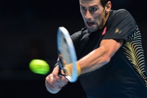 Serbia's Novak Djokovic returns against Switzerland's Roger Federer Serbia's Novak Djokovic returns against Switzerland's Roger Federer