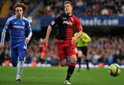 Portsmouth's Hungarian striker Marko Futacs (R) chases the ball in January 2012 Portsmouth's Hungarian striker Marko Futacs (R) chases the ball in January 2012