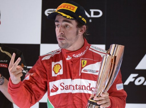 Ferrari's Spanish driver Fernando Alonso celebrates on November 4 after the Abu Dhabi Formula One Grand Prix Ferrari's Spanish driver Fernando Alonso celebrates on November 4 after the Abu Dhabi Formula One Grand Prix