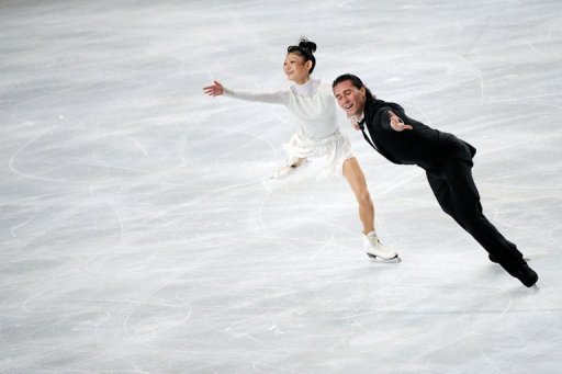 Yuko Kavaguti and Alexander Smirnov of Russia perform in their pairs short program Yuko Kavaguti and Alexander Smirnov of Russia perform in their pairs short program