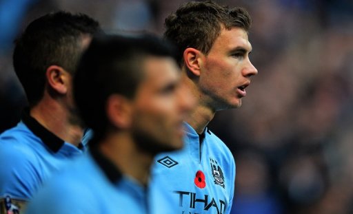 Manchester City's Edin Dzeko (R) celebrates scoring a goal against Tottenham Hotspur Manchester City's Edin Dzeko (R) celebrates scoring a goal against Tottenham Hotspur